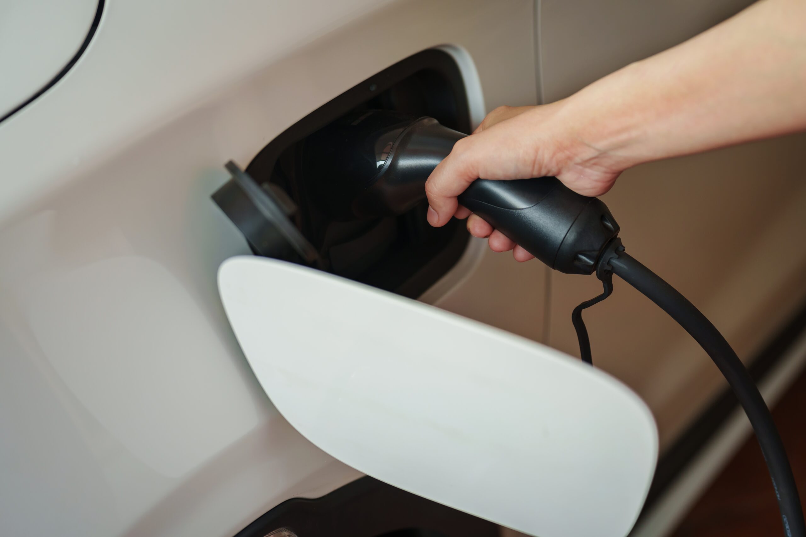 close,up,of,hand,charging,environmentally,friendly,zero,emission,electric close,up,of,hand,charging,environmentally,friendly,zero,emission,electric