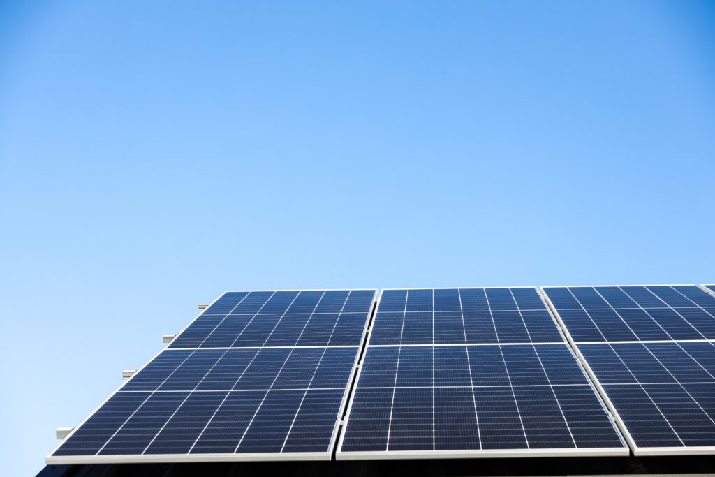 aerial,view,of,solar,panel,cells,on,clear,blue,sky aerial,view,of,solar,panel,cells,on,clear,blue,sky